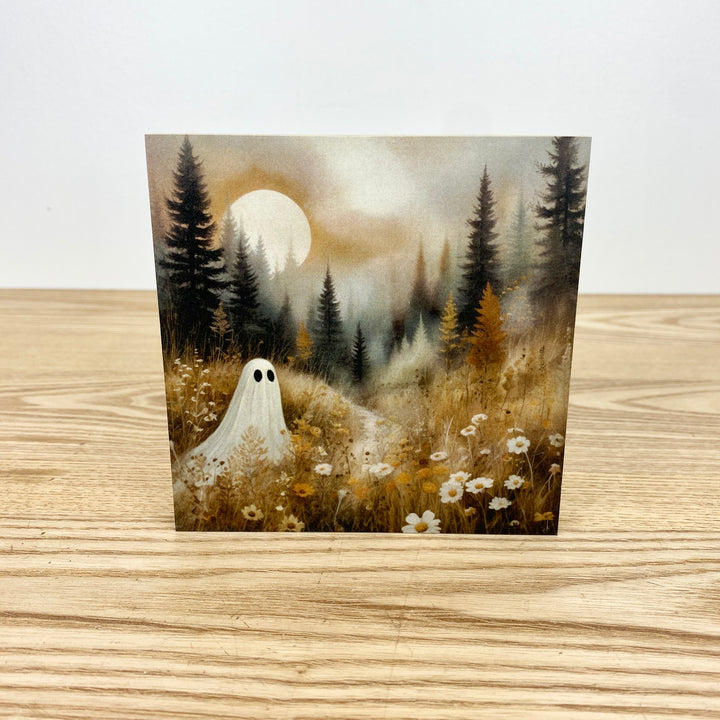 Ghost in a forest with a full moon on a wooden surface