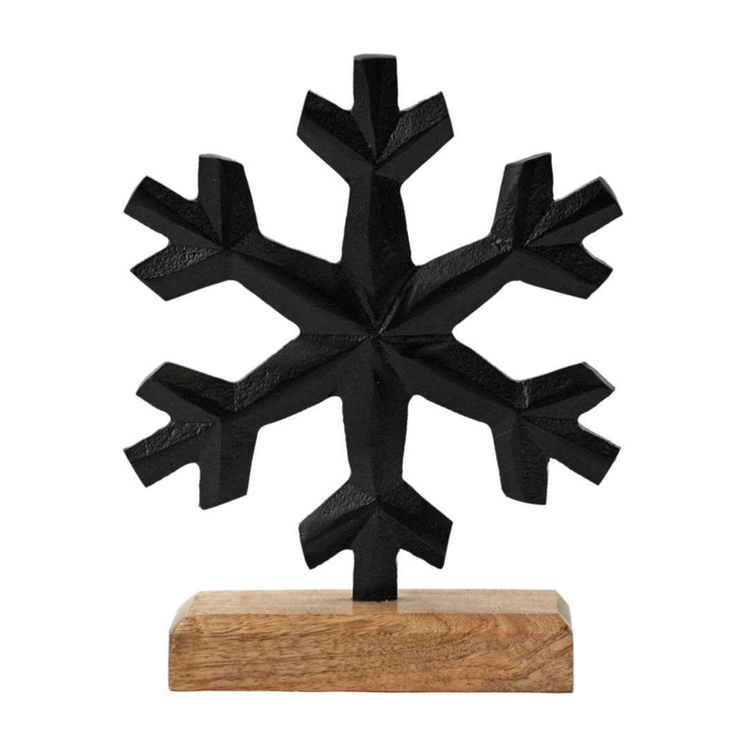 Black Metal Snowflake On Wooden Block
