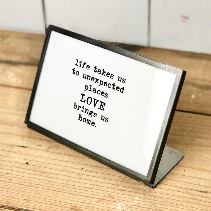 Metal and Glass Frame with Text