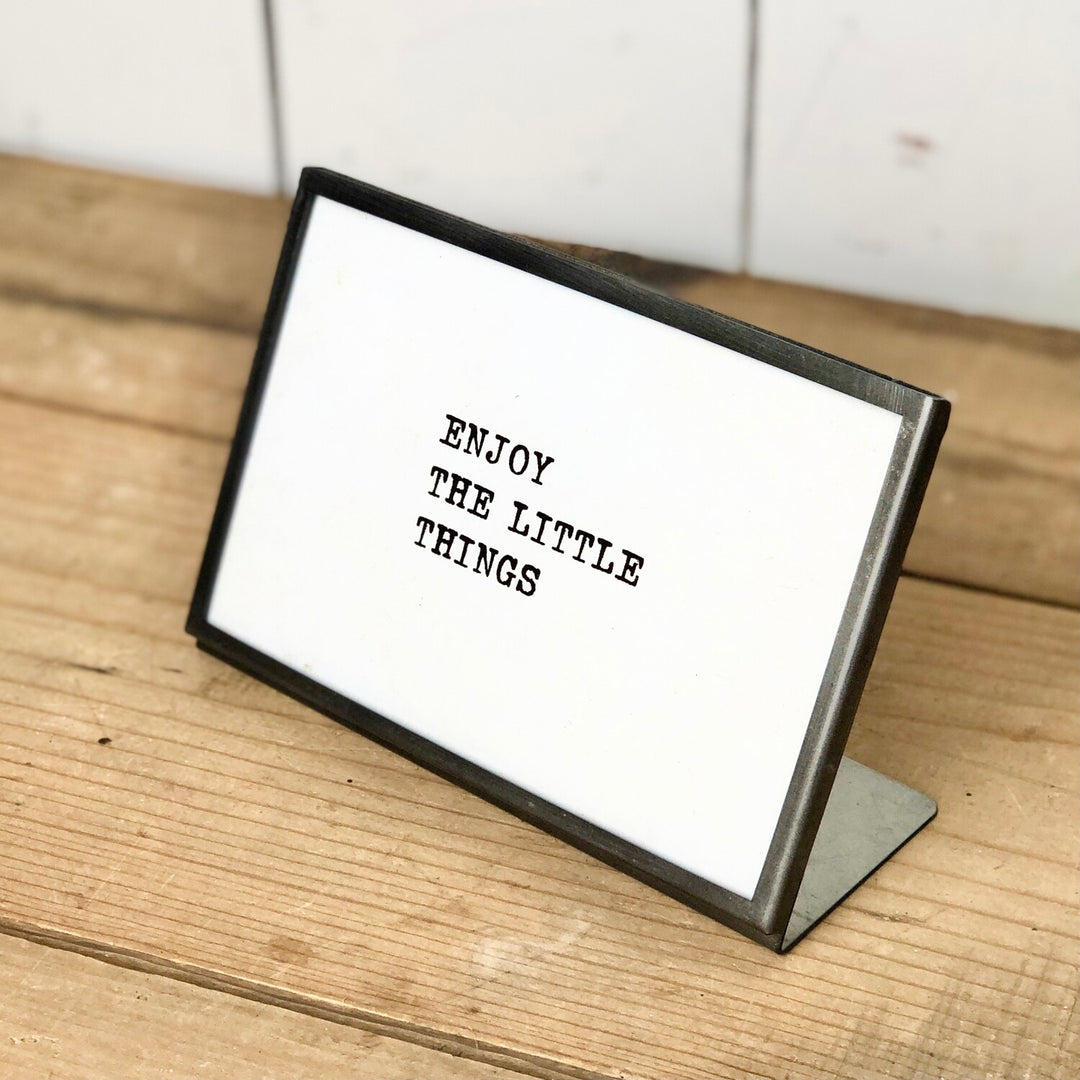 Metal and Glass Frame with Text