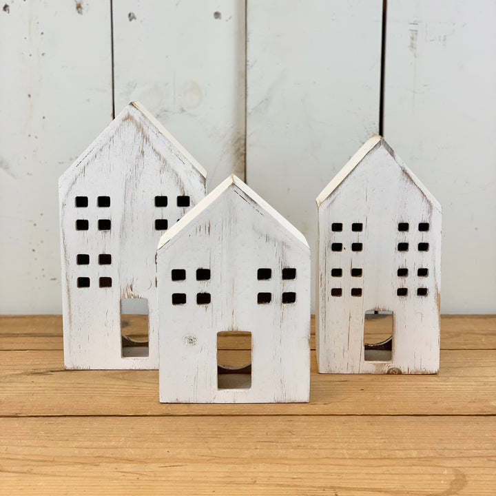 Distressed Wooden Houses with Light Hole