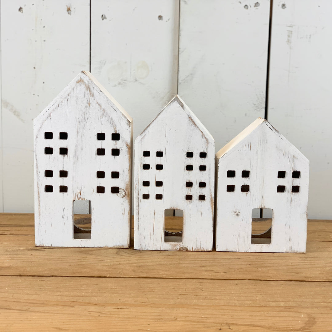 Distressed Wooden Houses with Light Hole